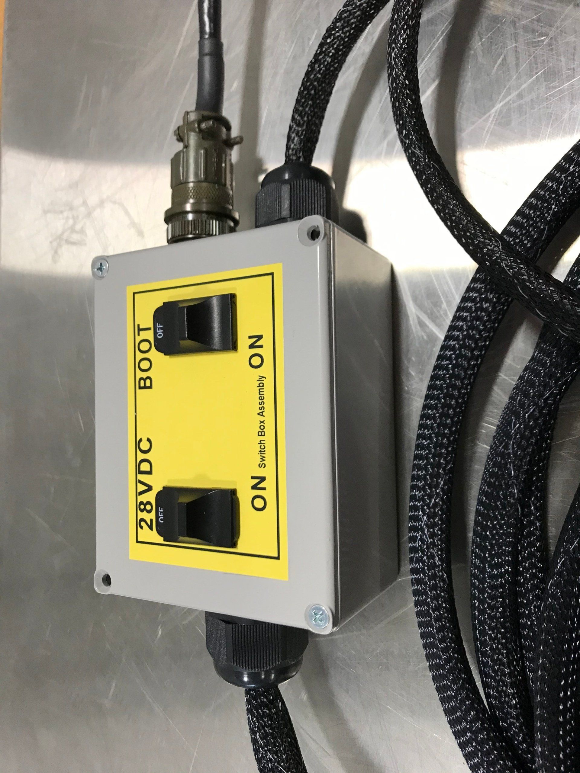 A box with two switches that say on and boot