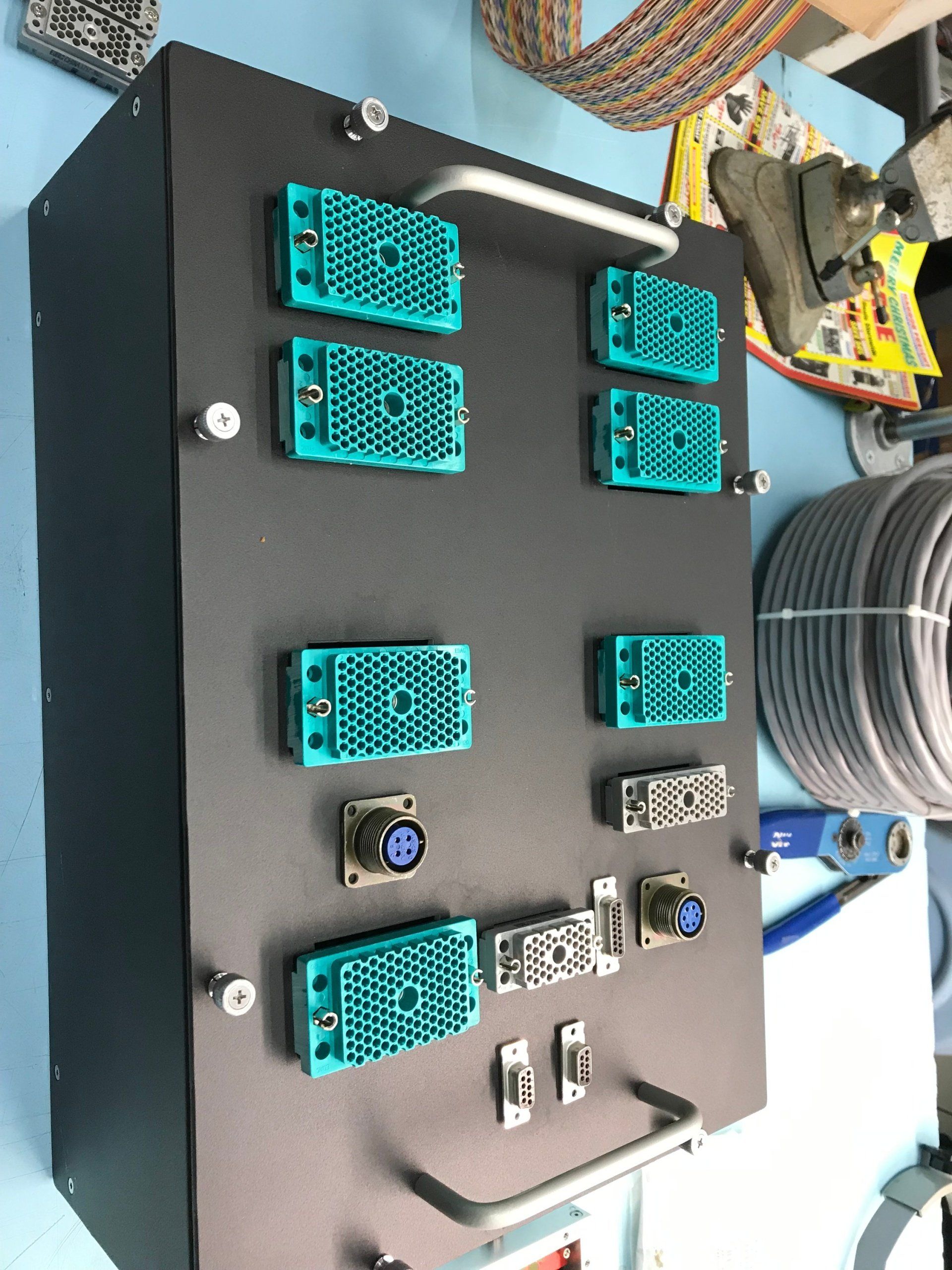 A black box with blue connectors on it