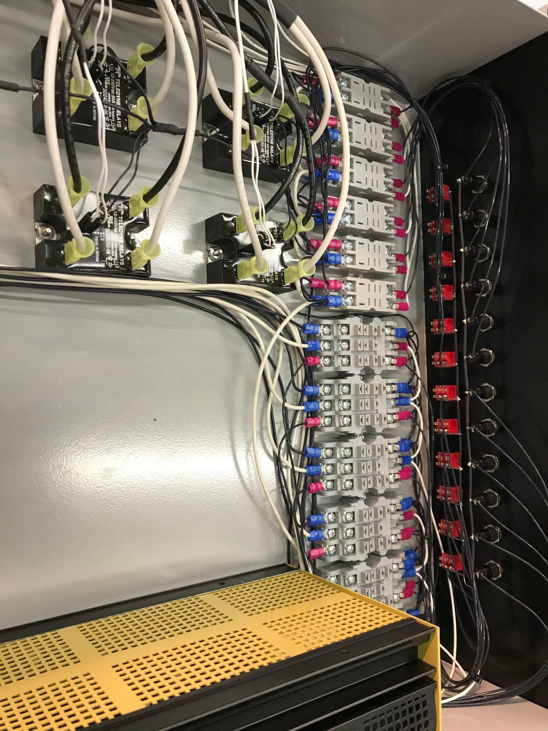 A bunch of wires are coming out of a box