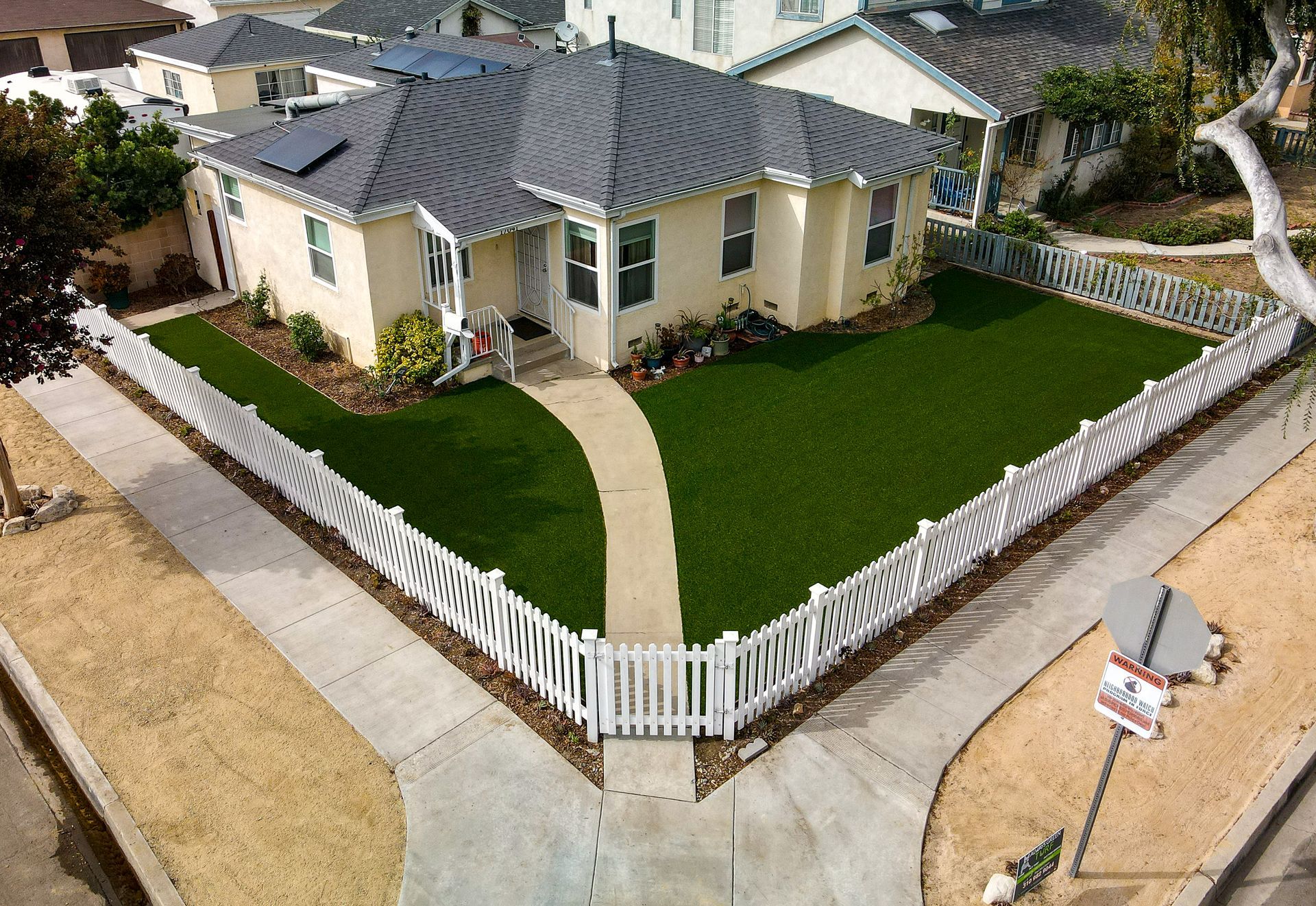 artificial grass near sidewalk