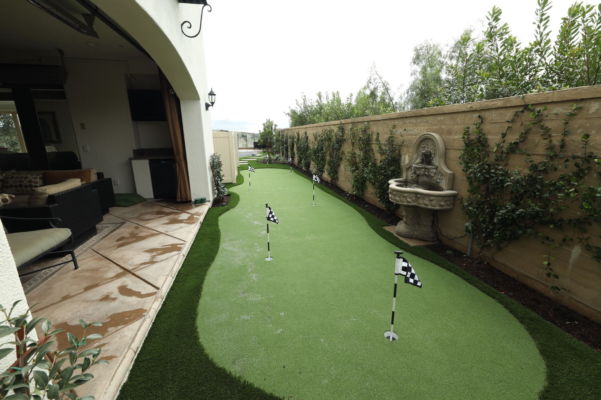 rock feature near  artificial grass