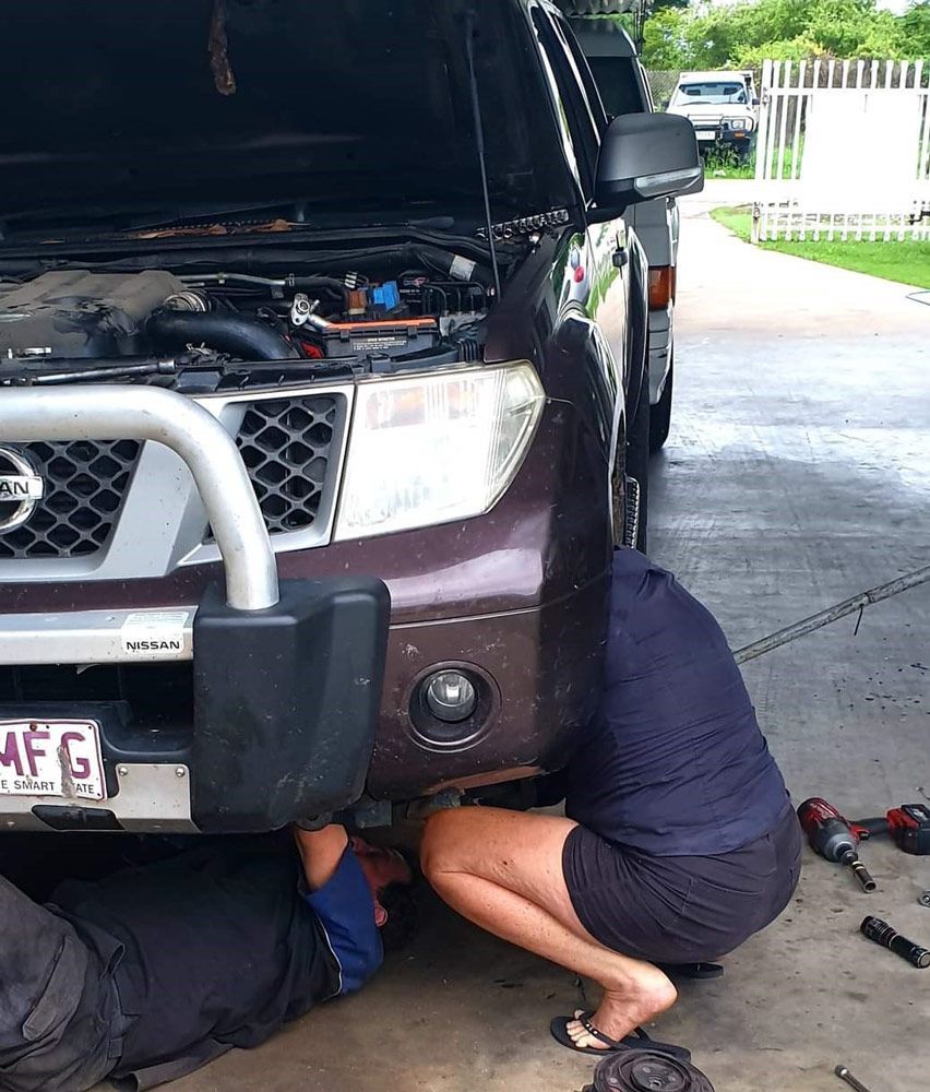 Two Mechanics Repairing Under Car — Kirk Auto Know Mechanical in Stuart, QLD