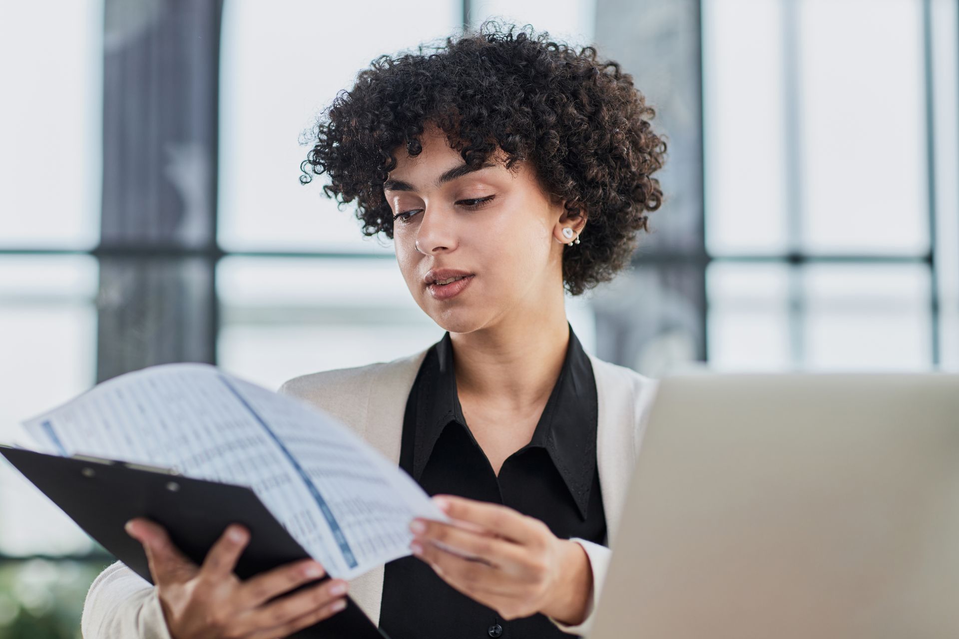 Professional reviewing rent payment history for chronic late payment application in Ontario