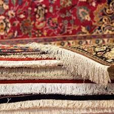 A stack of rugs sitting on top of each other on a table.