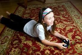 Little girl lying on the carpet