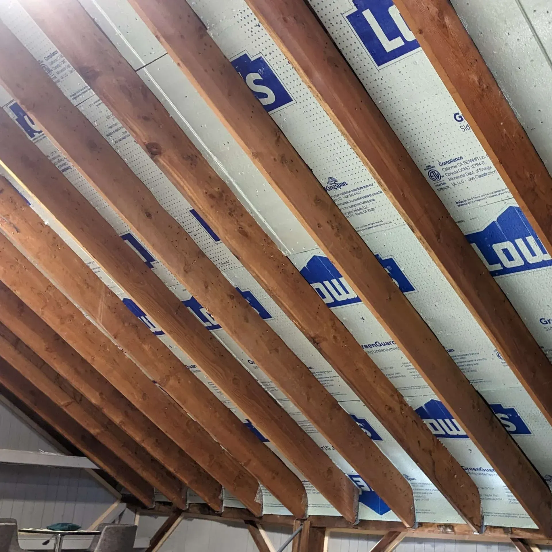A ceiling with a lowe 's logo on it