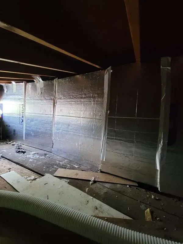 A room with a lot of aluminum foil on the wall.