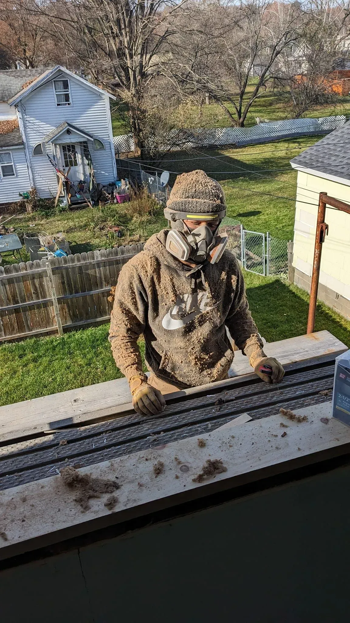 A man is standing on top of a train track.
