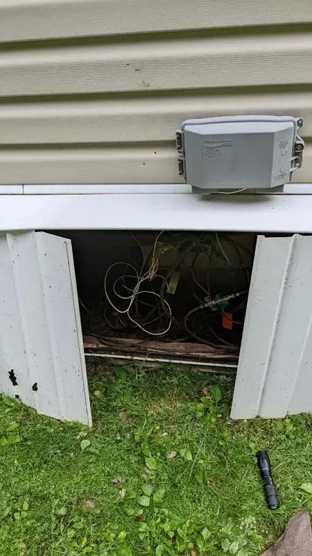 There is a box in the corner of a garage door.