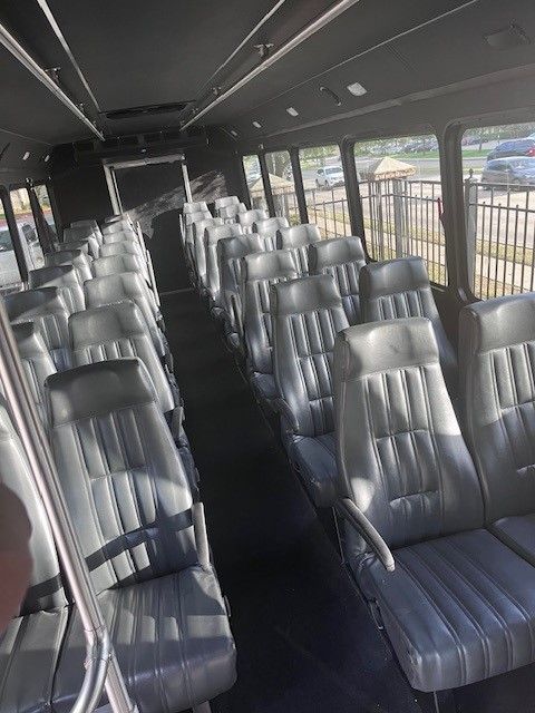 The inside of a bus with a lot of seats