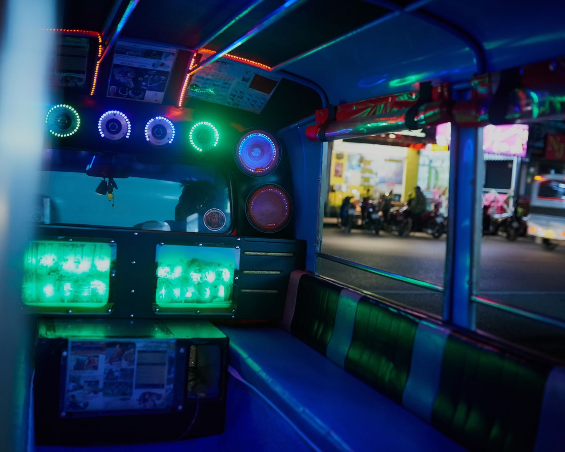 The inside of a bus with a lot of lights on it