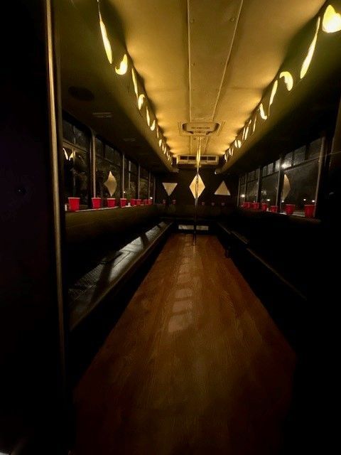 A long hallway with a lot of lights on the ceiling