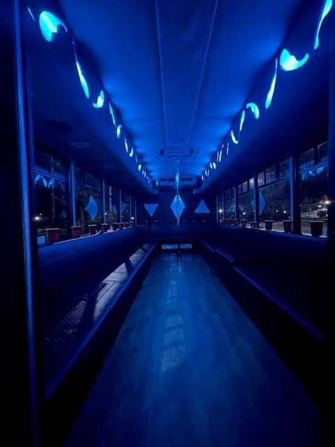 A dark room with blue lights on the ceiling