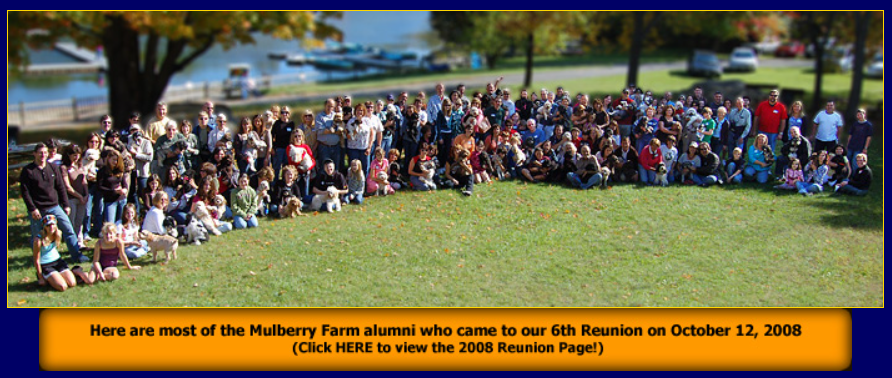 Large group of people gathered on a grassy hill, possibly at a Mulberry Farm reunion on October 13, 2009.