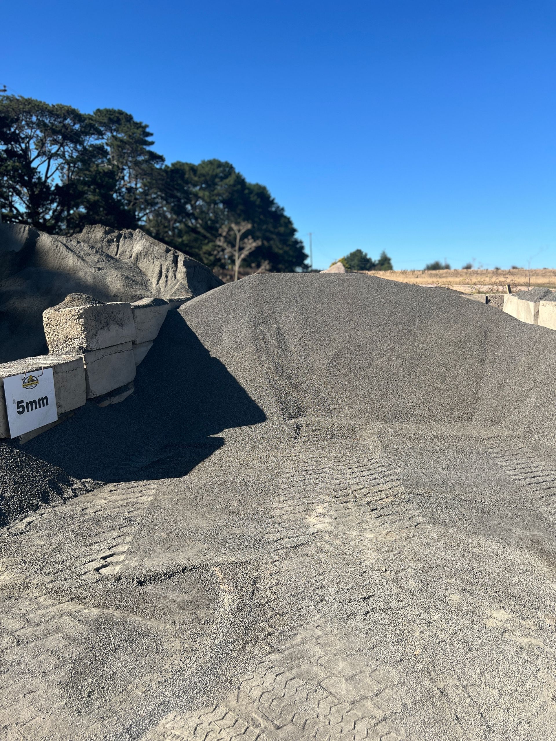 A Large Pile Of Gravel Is Sitting On Top Of A Dirt Field — Pigot's Mid Western Sand and Soil In Orange, NSW