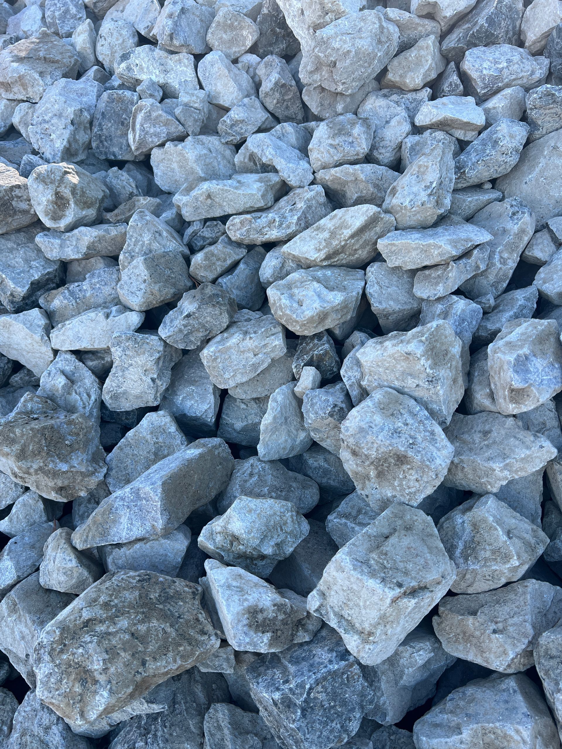 A Pile Of Rocks Is Sitting On The Ground In Front Of A Building — Pigot's Mid Western Sand and Soil In Orange, NSW
