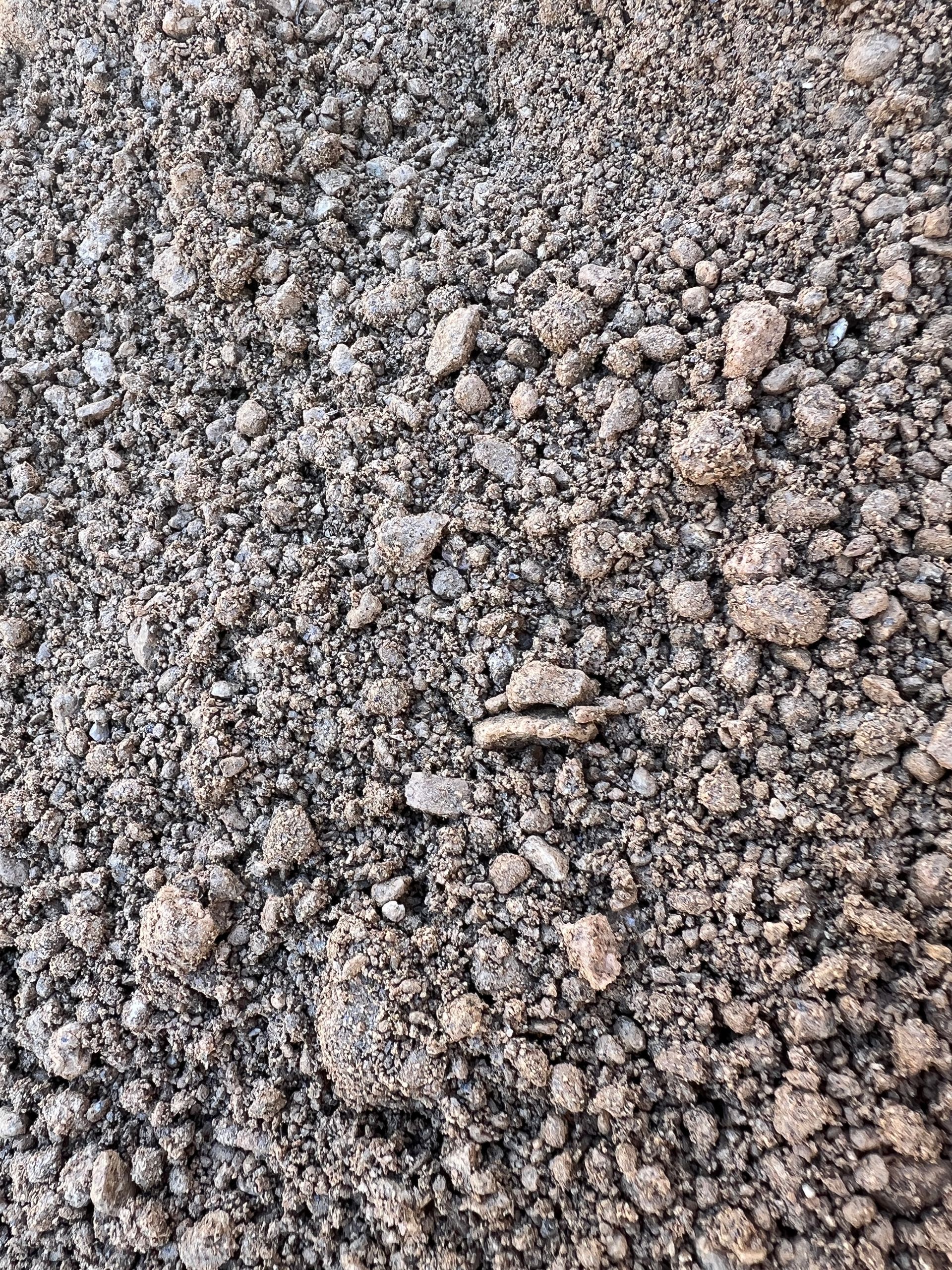 A Pile Of Dirt Is Being Scooped Out Of A Bulldozer — Pigot's Mid Western Sand and Soil In Orange, NSW