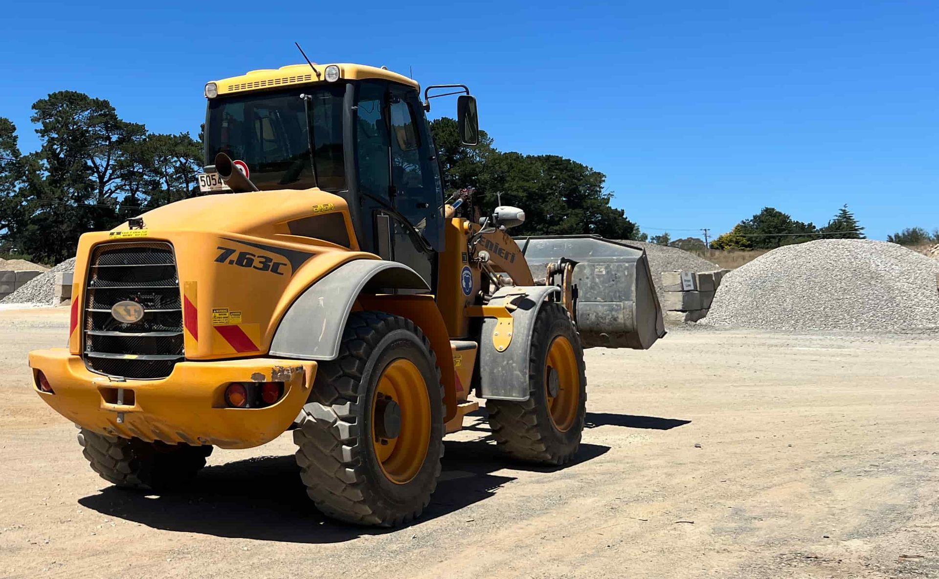 Piles of sand with trees in the background — Pigot's Mid Western Sand and Soil In Orange, NSW