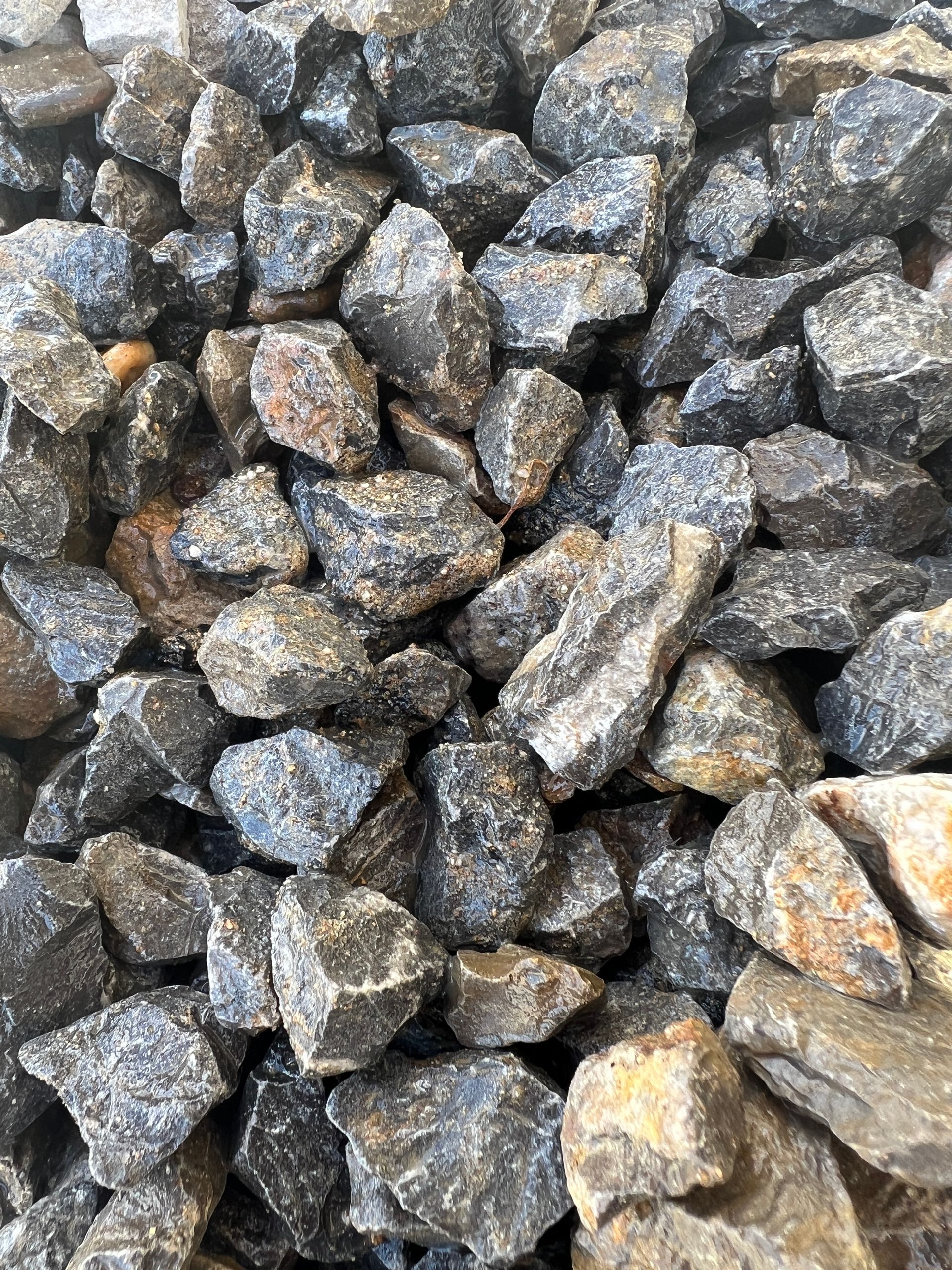 A pile of rocks sitting on top of each other on the ground — Pigot's Mid Western Sand and Soil In Orange, NSW
