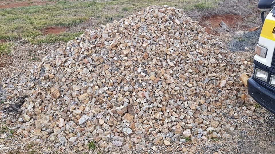 A Pile Of Gravel Is Sitting Next To A Truck — Pigot's Mid Western Sand and Soil In Orange, NSW