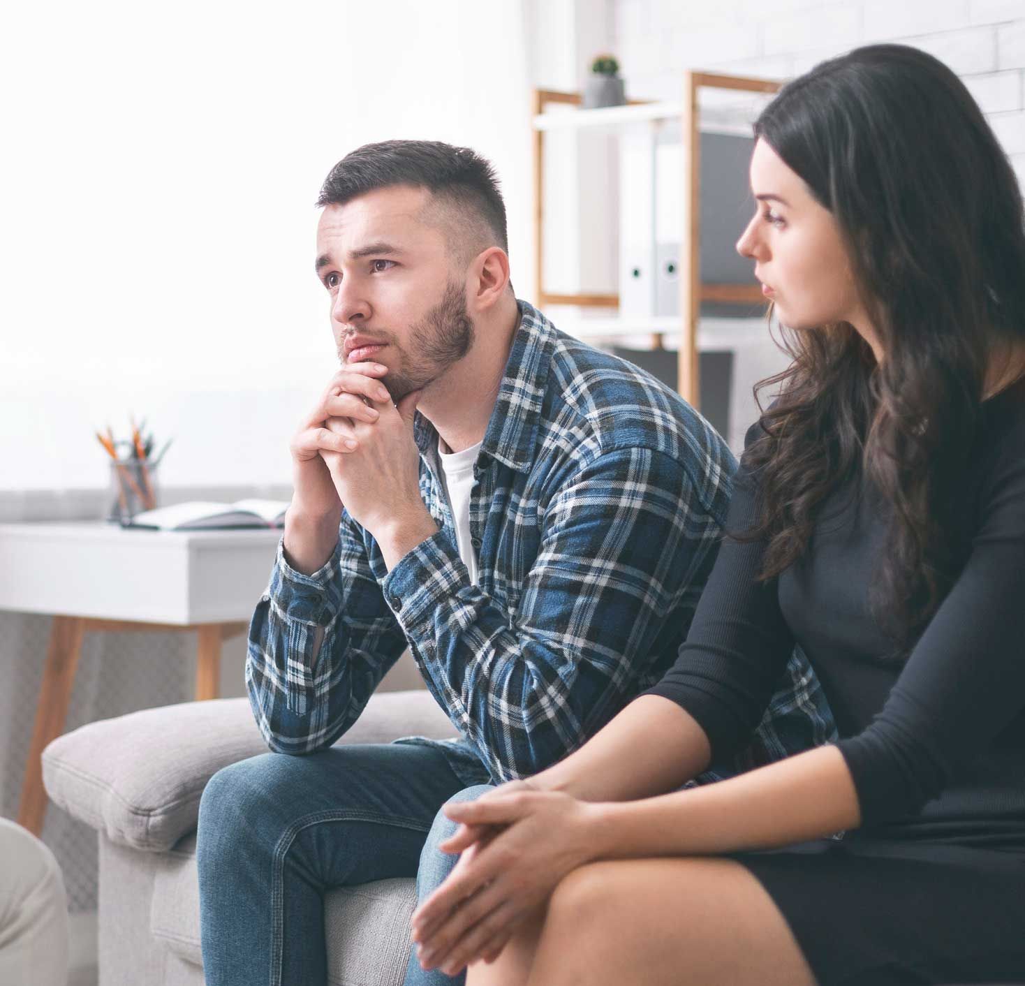 A couple sitting on a couch.