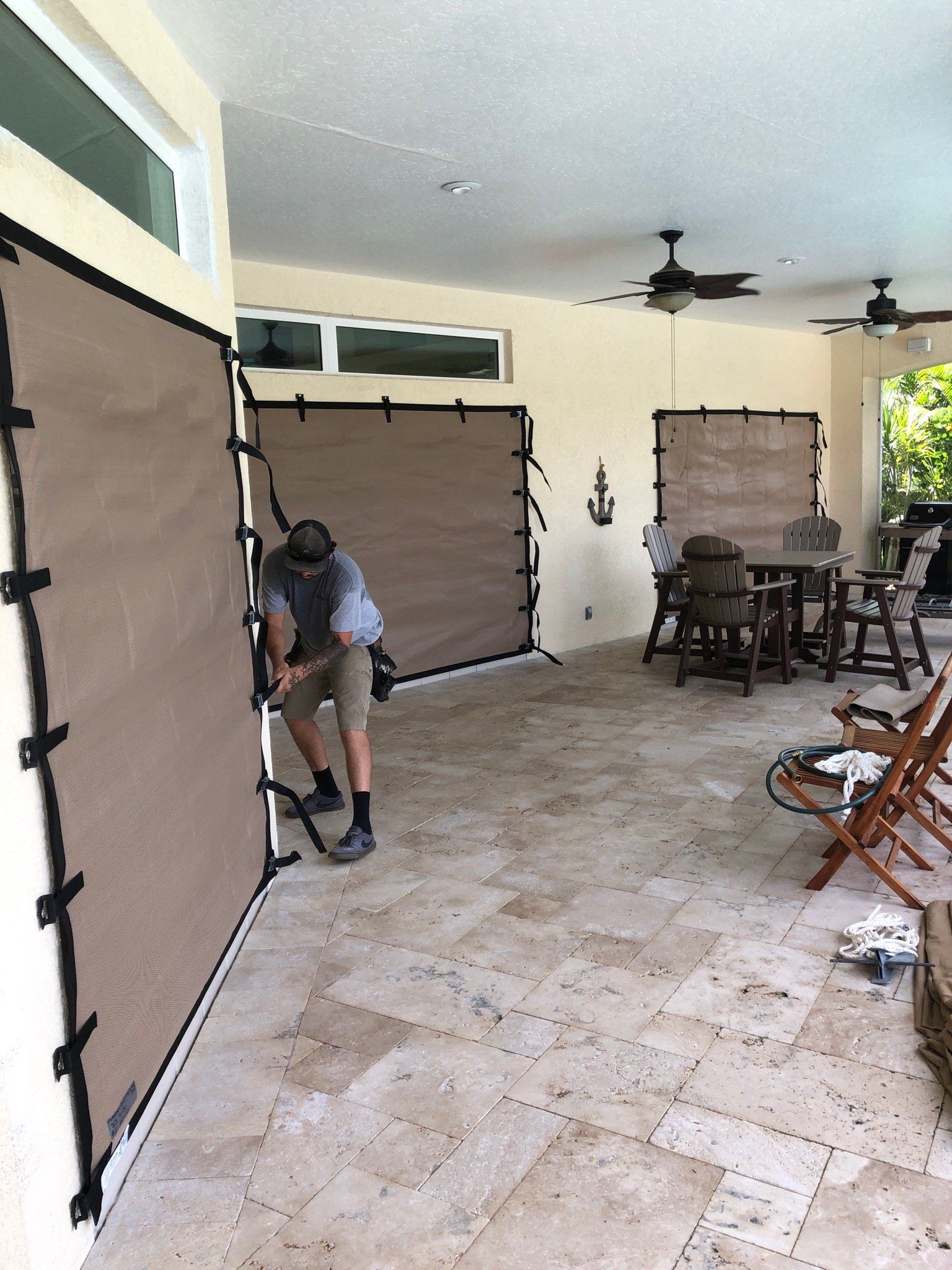 Man Working On Screens — Melbourne, FL — Roll Tite Shutters