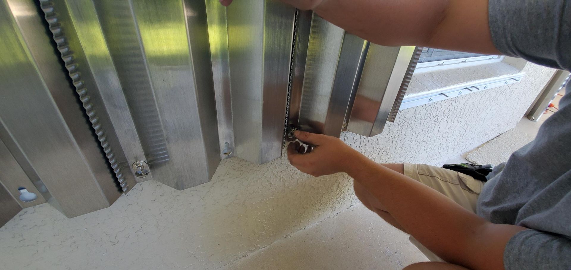 Installation of panel - Melbourne, FL - Roll Tite Shutters