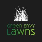 A logo for Green Envy Lawns with a picture of Grass on a black background.