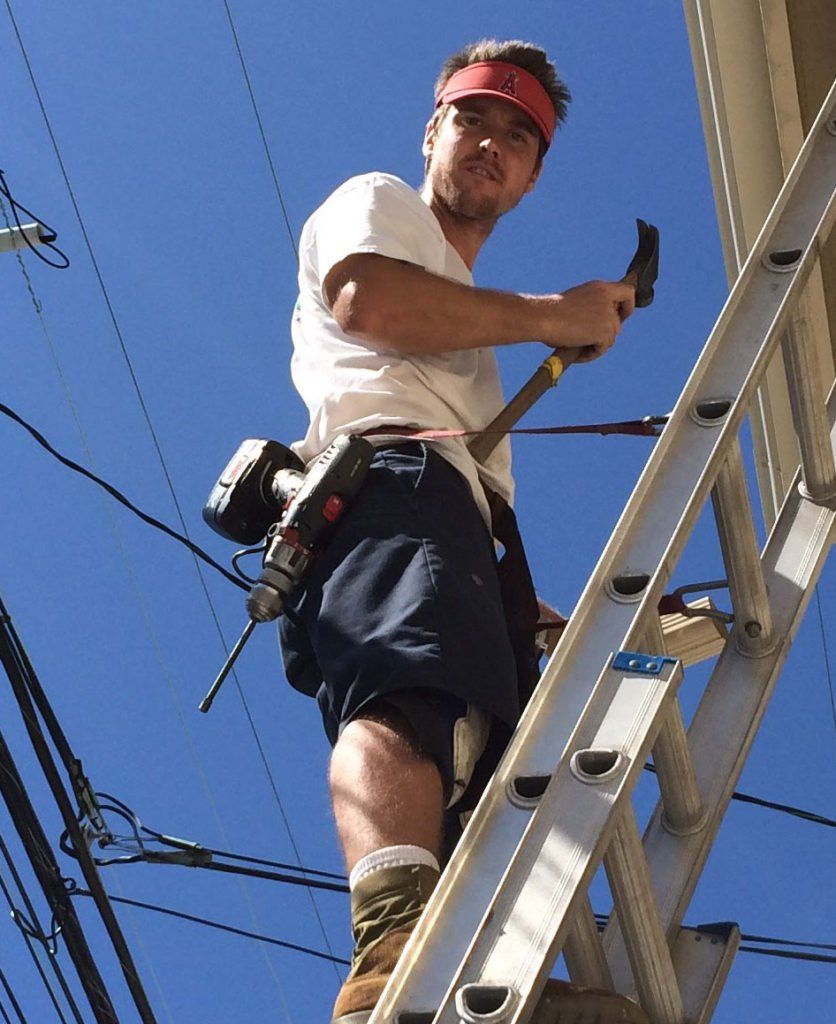 Man looking down — Huntington Beach, CA — California Gutter Co, Inc.