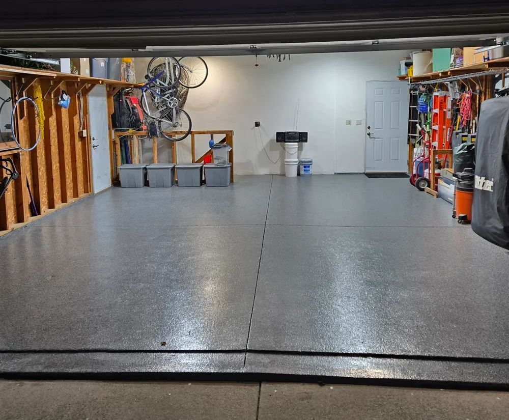 A garage with a bicycle hanging on the wall