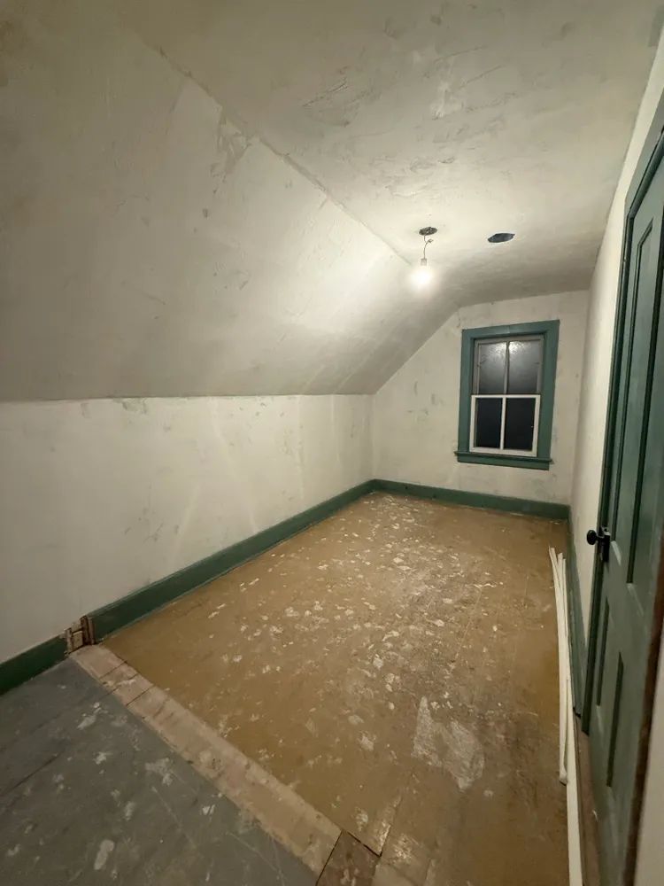 There is a window in the corner of the room.