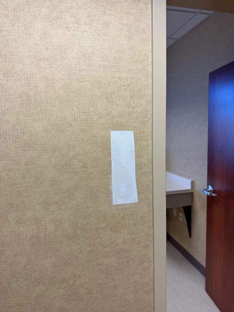 A door with a piece of paper taped to it.
