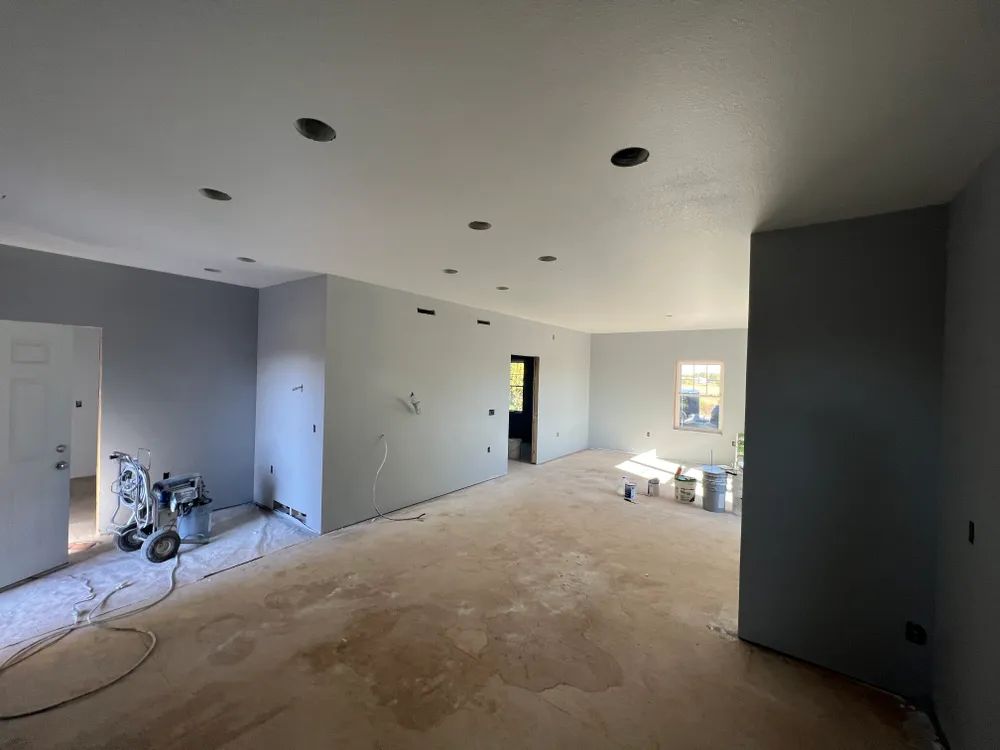 There is a vacuum cleaner in the middle of the room.