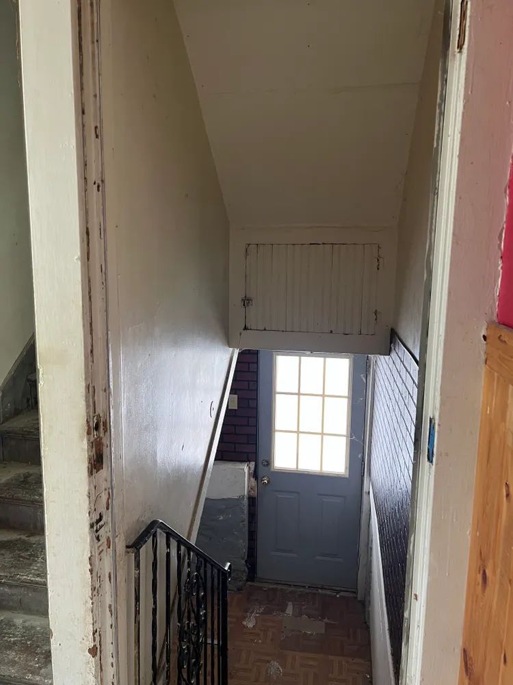 A staircase leading up to a door in a building