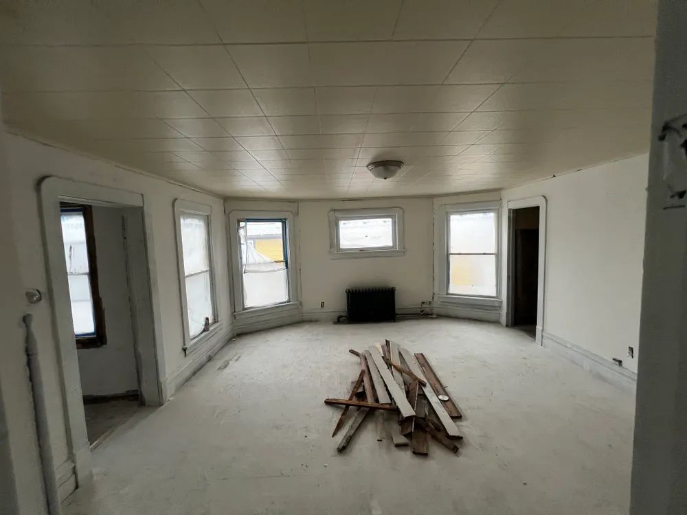 There is a pile of wood in the middle of the room.