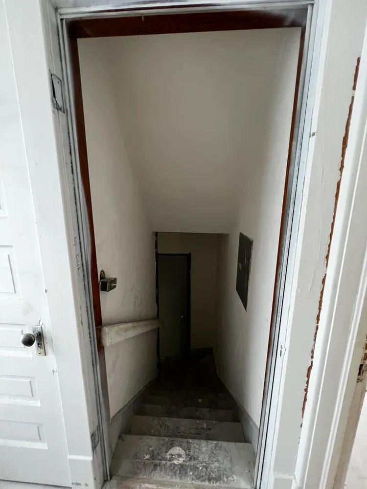 A doorway leading up to a set of stairs