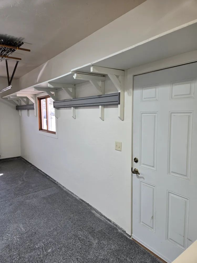 There is a door and a window in the room.