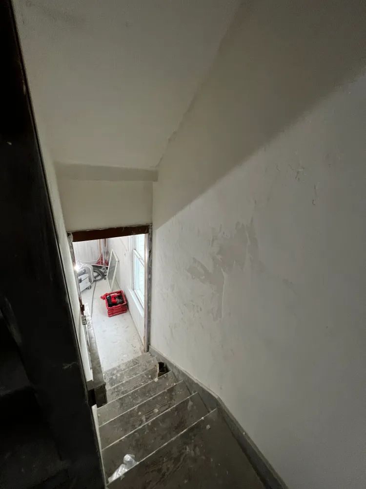 A set of stairs leading up to a room in a building.