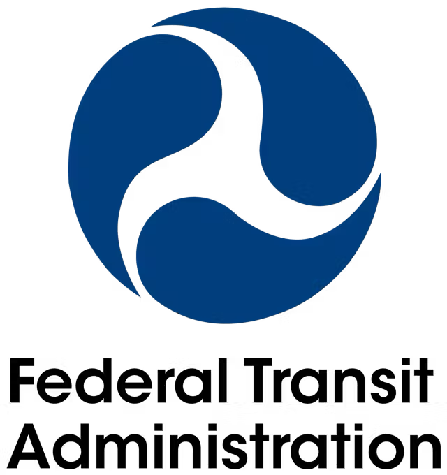 A blue and white logo for the federal transit administration