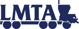 A blue logo for lmta with a semitruck in the background