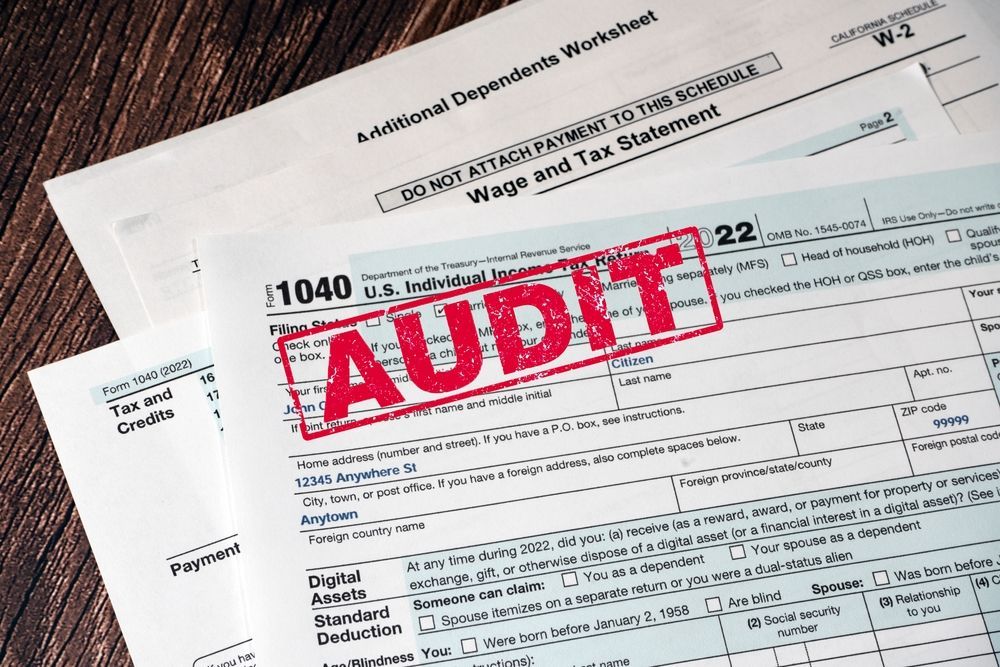 A tax form with the word audit stamped on it