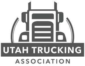 A logo for utah trucking with a truck on it.