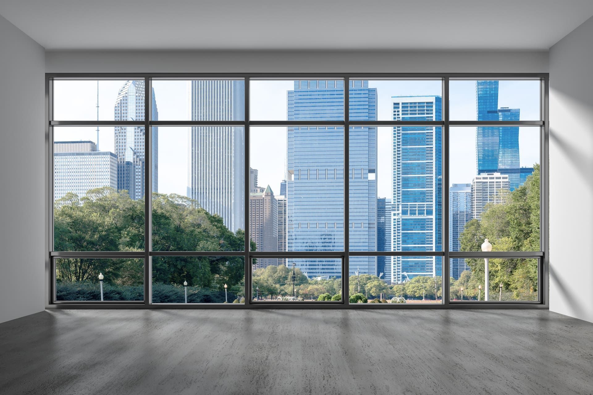 Closed white window overlooking green garden. Green trees outside the window