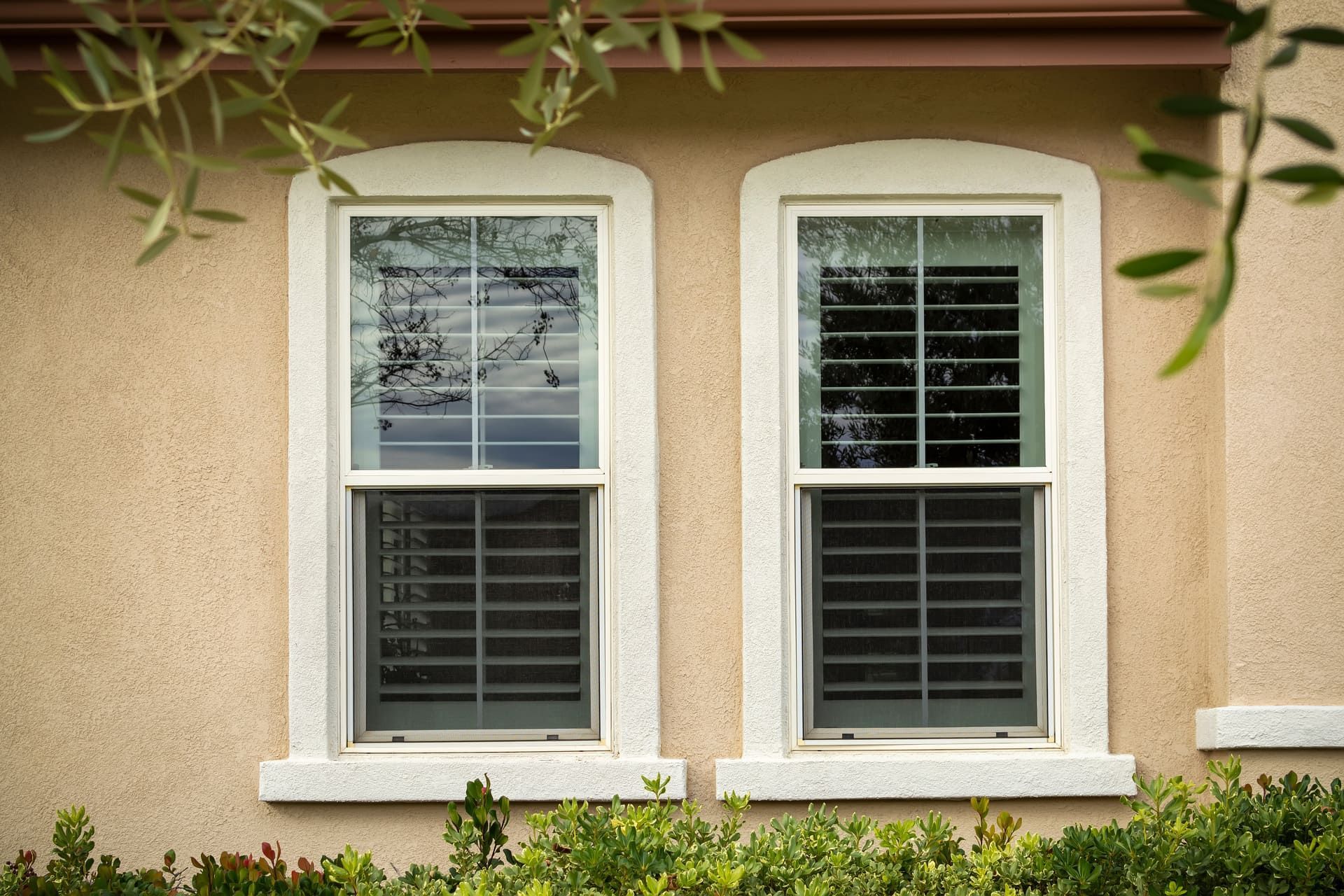 Single-Hung windows on stucco wall, exterior close-up view, Menifee, California