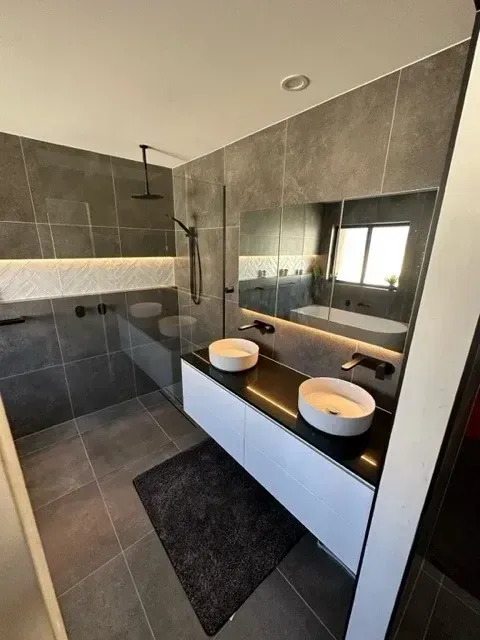 Modern Bathroom With Grey Tile Walls — Precise Plumbing & Drainage In Conder, ACT