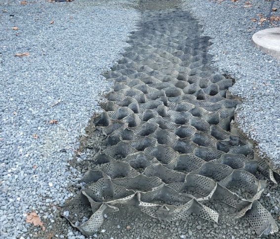 Blue chemical drums with hazard warning labels.