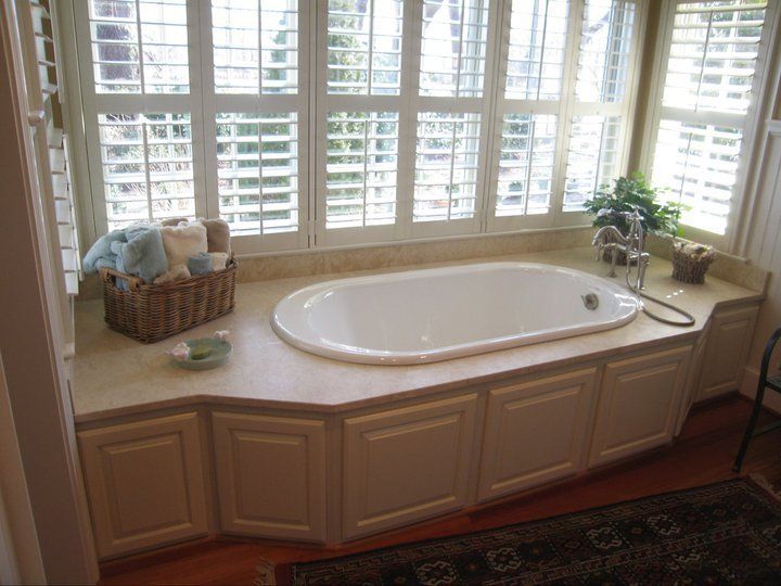 Bathroom with bathtub beside the window — Powhatan, VA — Commonwealth Countertops