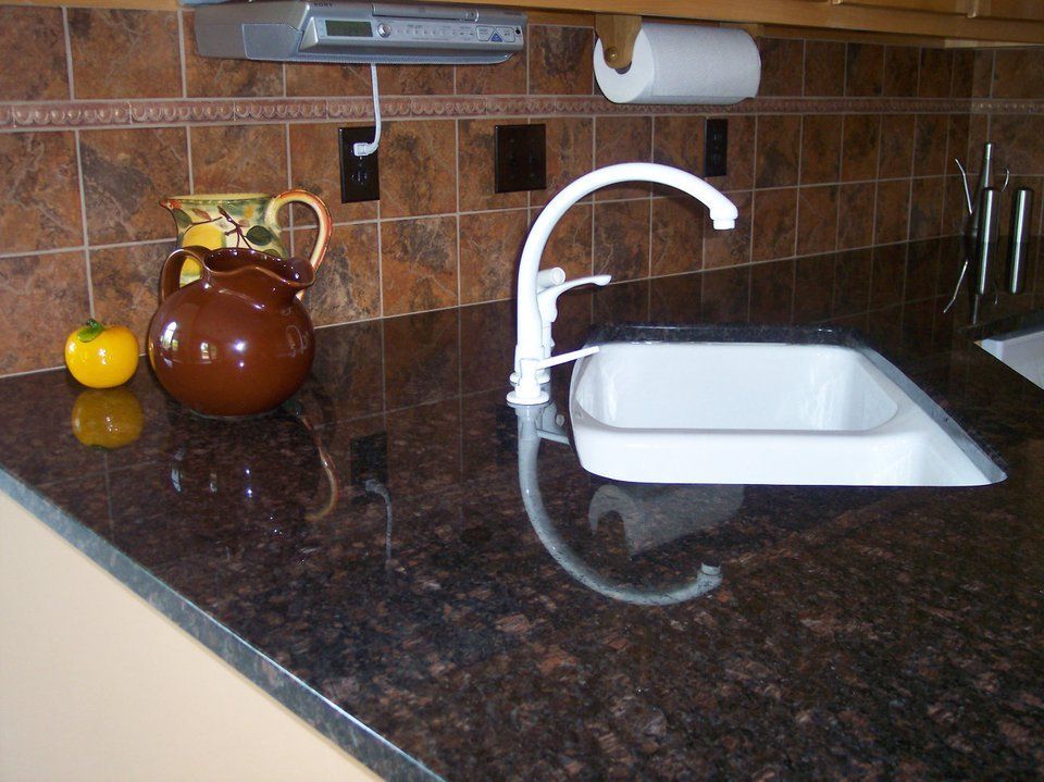 Shiny countertop with white sink — Powhatan, VA — Commonwealth Countertops