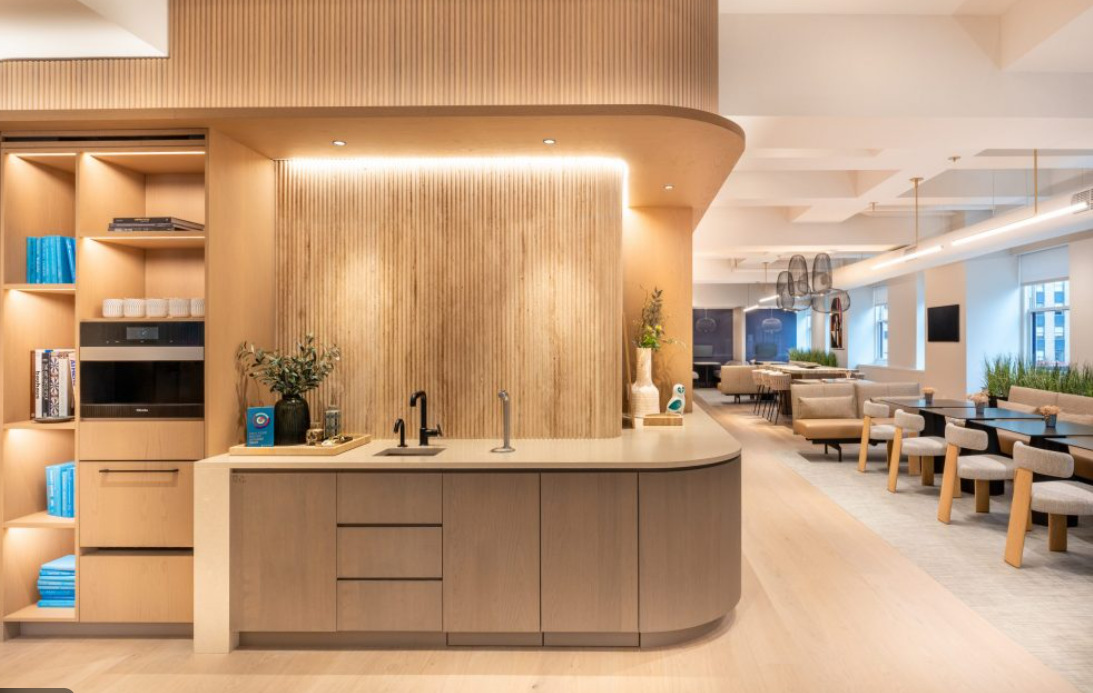 Canadian business owner planning GST filings on a laptop with coffee in a calm, modern home office