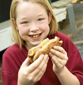 Girl Eating hotdog — Camping in Peroria, IL